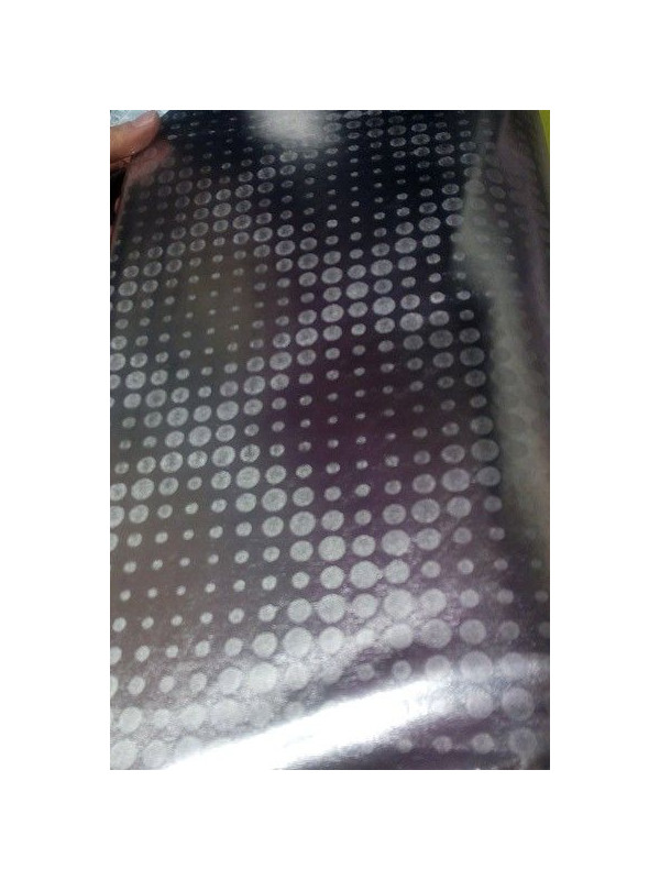 Tejido elástico laminado con motas