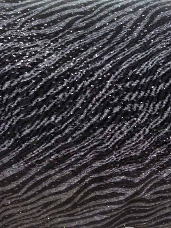 Tejido punto cebra brillante