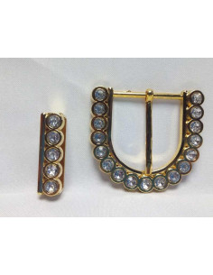 Hebilla de metal dorada con pedrería