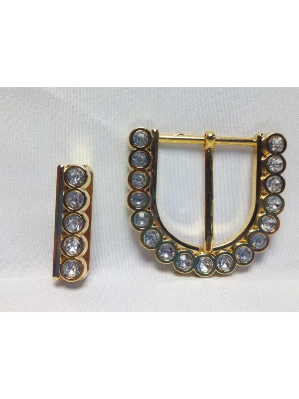 Hebilla de metal dorada con pedrería