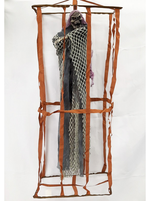 Esqueleto preso en jaula